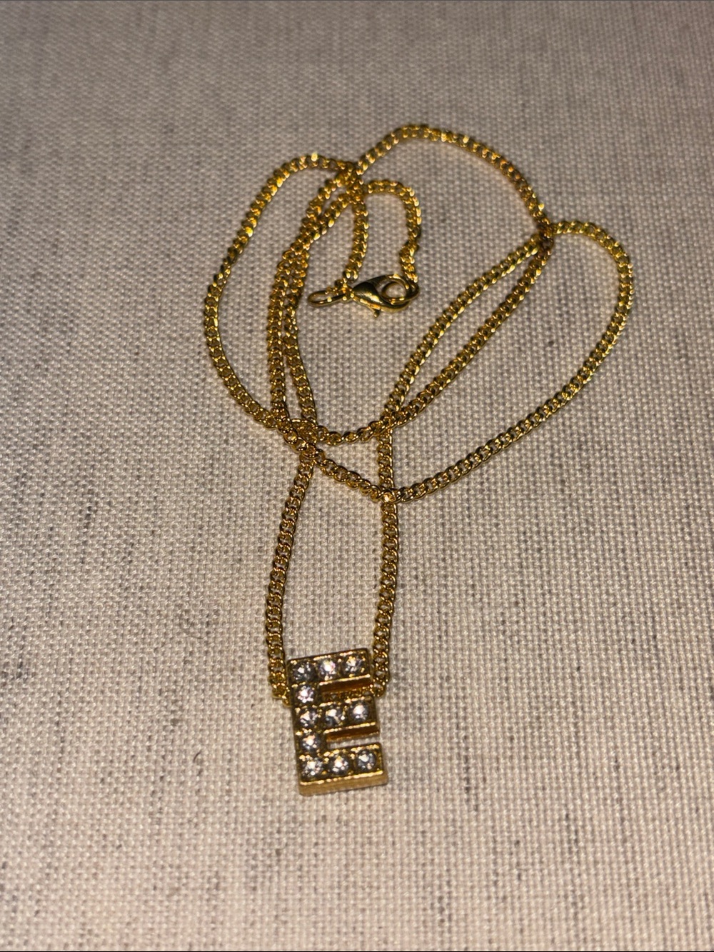 Gold plate chains with E charm